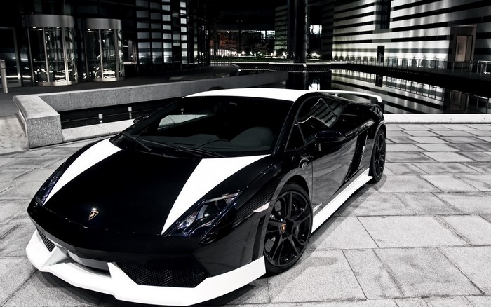 Black and white Lamborghini Gallardo parked at night