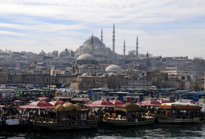 Istanbul cityscape with boats and Suleymaniye Mosque