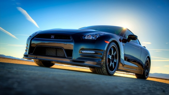Black Nissan GT-R sports car on a desert road