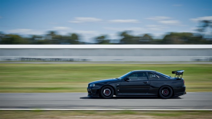 Black Nissan Skyline GT-R R34 on a Racetrack