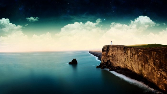 Cliff overlooking the sea with a lighthouse