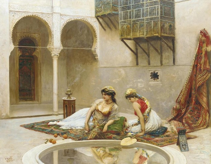 Two women in a courtyard with a fountain and ornate architecture