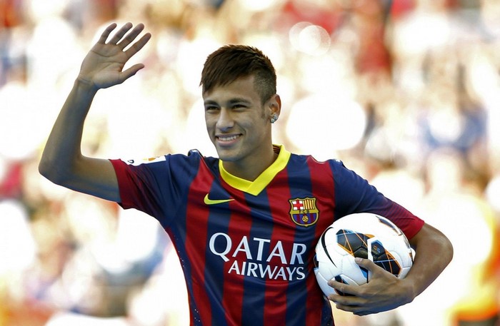 Neymar Jr. waving with a soccer ball