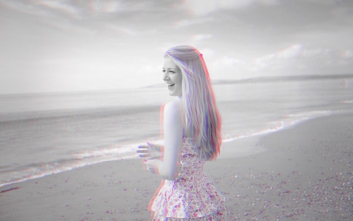 Woman in floral dress on a beach with anaglyph 3D effect