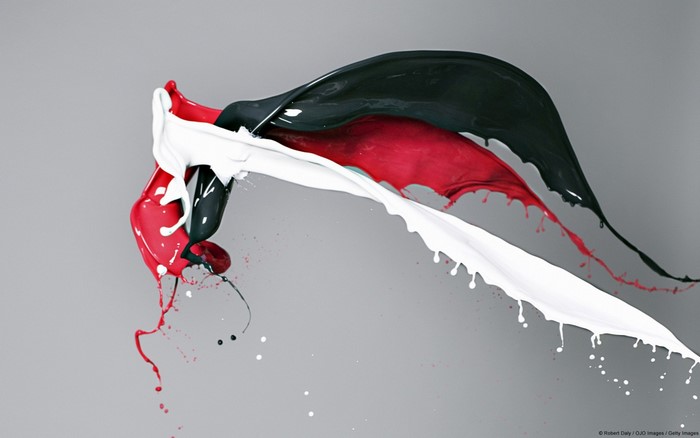 Red, black, and white paint splashing