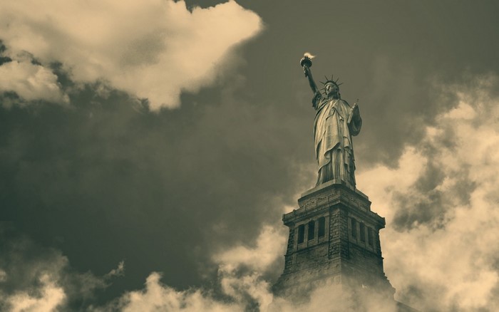 Statue of Liberty against a cloudy sky