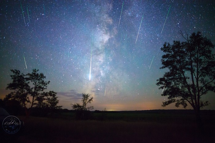 Milky Way and shooting stars over a landscape