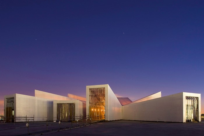 Modern building facade at dusk with stars