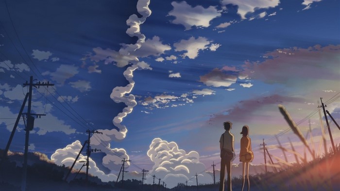 Two people looking at clouds and sky