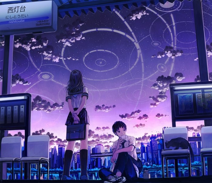 Two students at a train station at night