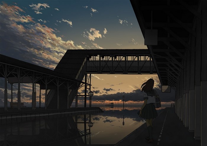 Girl at train station during sunset with reflection