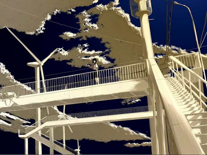 Girl on a bridge with wind turbines and clouds