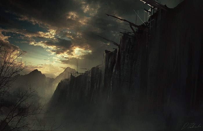 Dark mountains with sunlight breaking through clouds