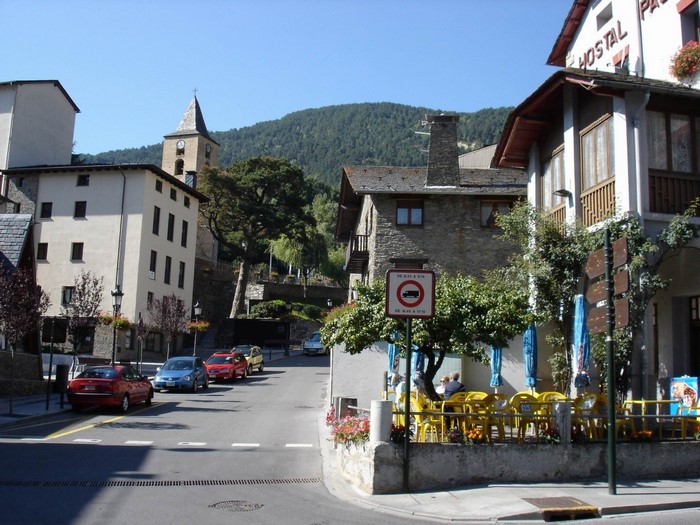 Street scene in a European village with a church tower