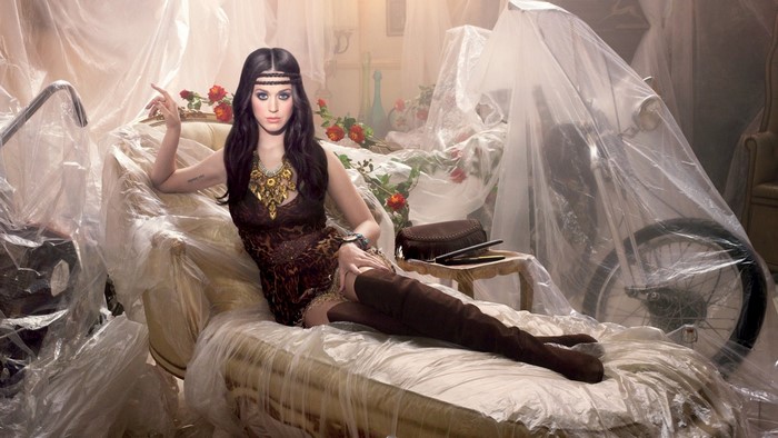 Katy Perry in a leopard print dress and thigh-high boots