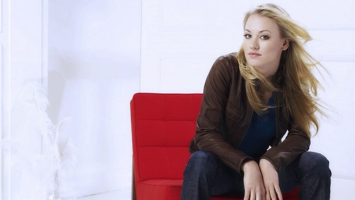 Yvonne Strahovski sitting on a red chair