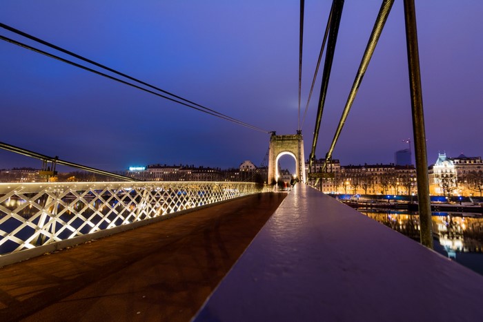 Bridge over river in Lyon at dusk