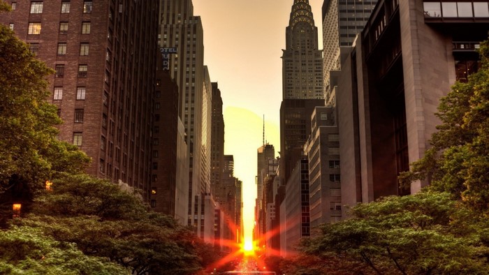 Manhattanhenge sunset over New York City skyscrapers