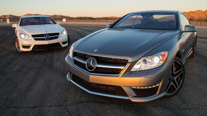 Two Mercedes-Benz CL-Class cars on a road