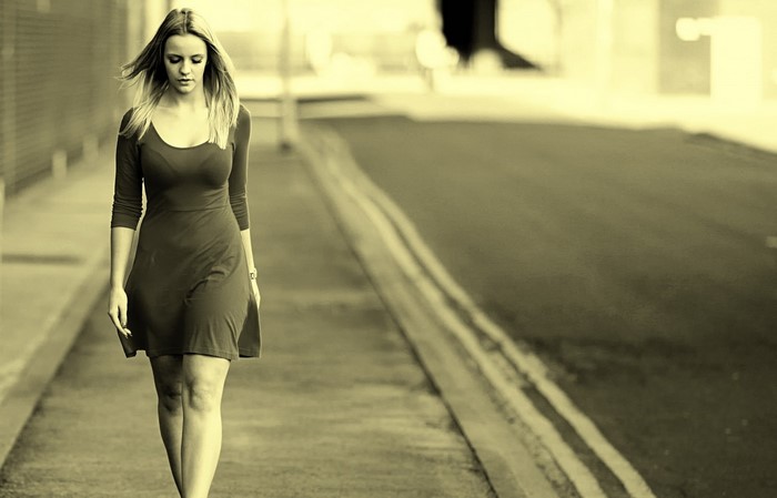 Woman in a dress walking on a street