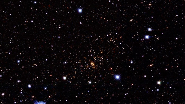 A dense star cluster in outer space with many stars