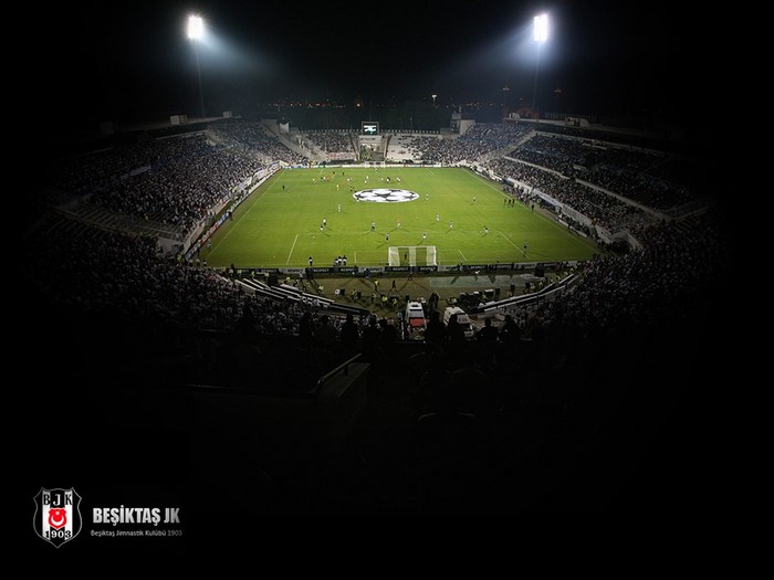 Beşiktaş JK stadium at night with soccer match