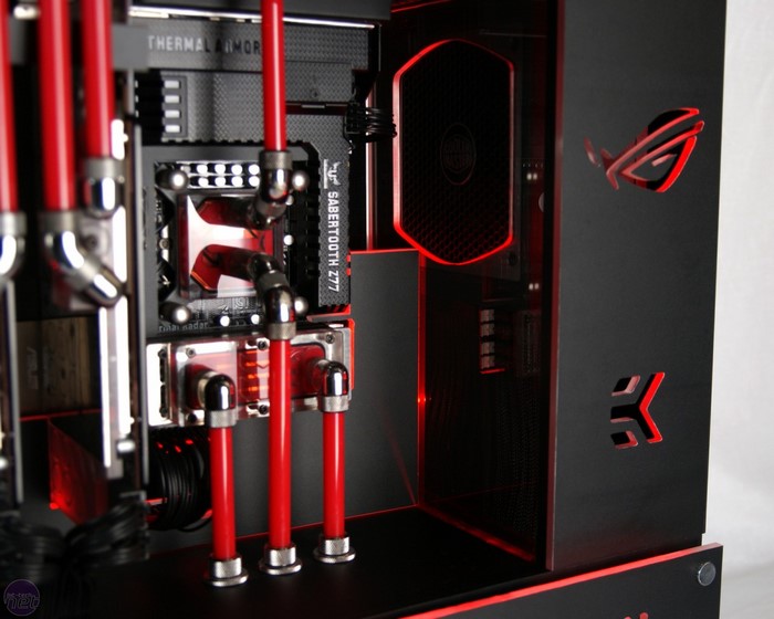 Custom PC build with red liquid cooling and ROG branding