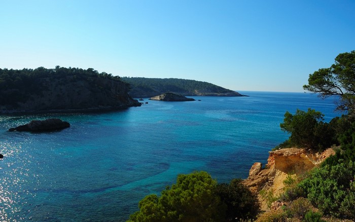 Serene Coastal Bay with Clear Blue Waters