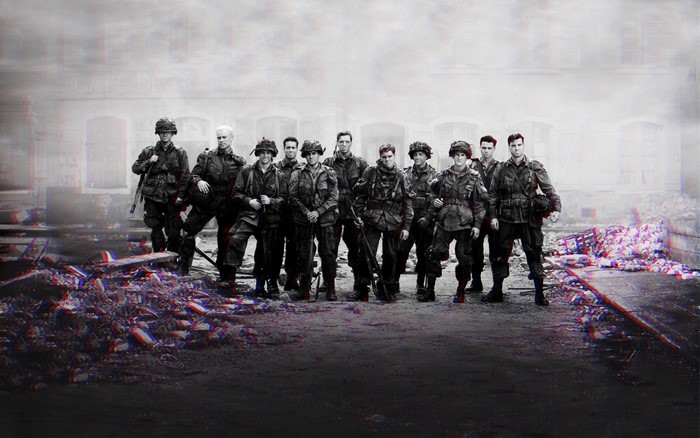 Soldiers from Band of Brothers in front of a building