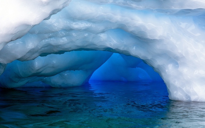 Ice cave with blue water