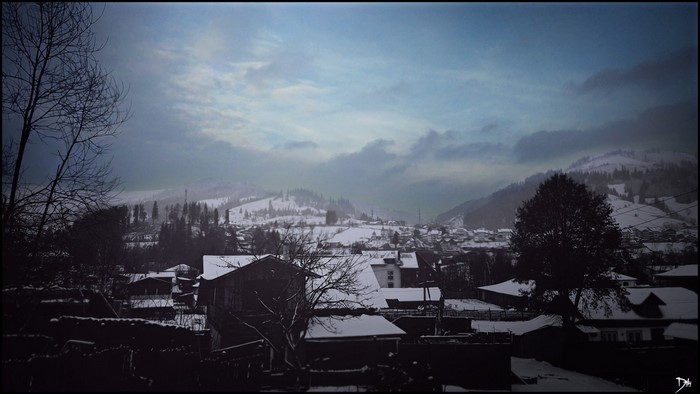 Winter village in Vatra Dornei, Romania at dusk