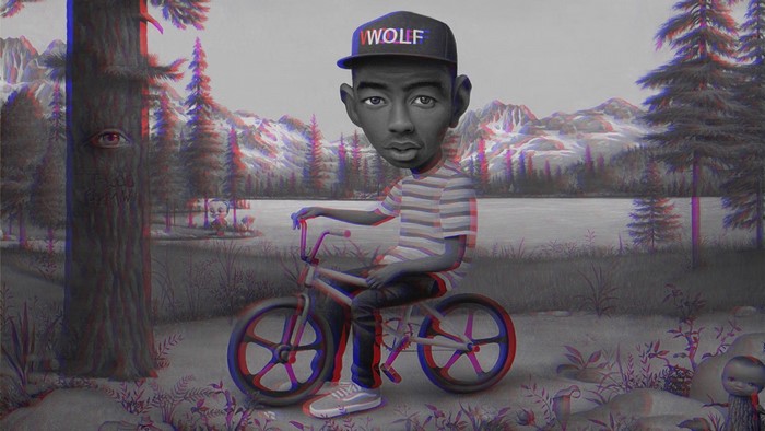 Tyler the Creator on a BMX bike in a surreal landscape