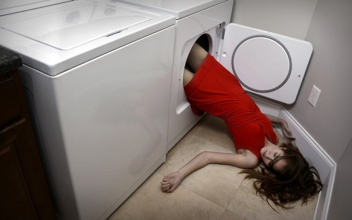 Woman in red dress stuck in washing machine