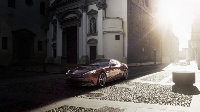 Aston Martin Vanquish parked in front of a church