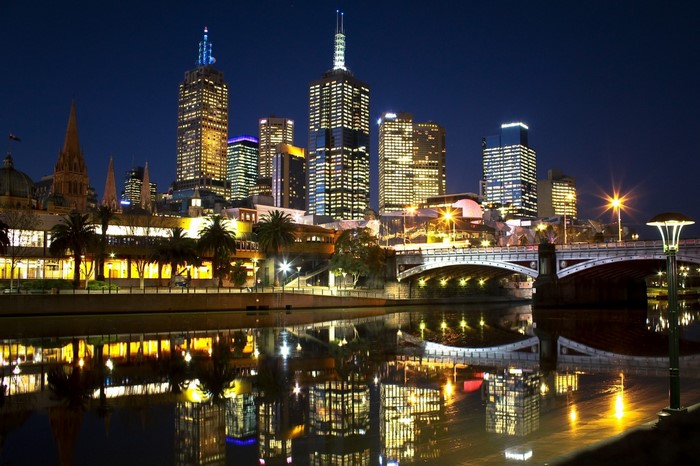 Melbourne skyline at night with Yarra River reflections