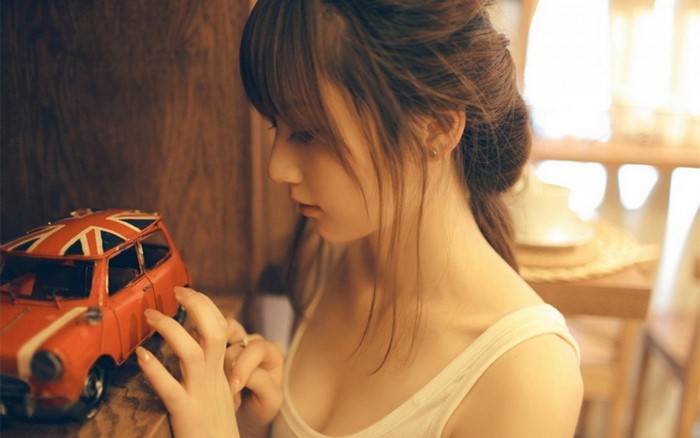 Asian girl with toy car