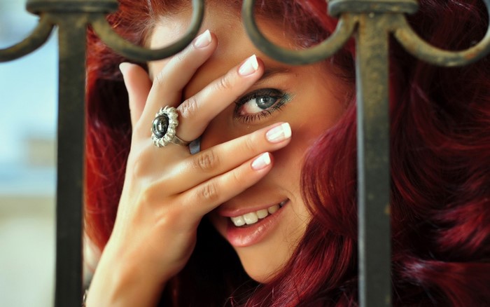 Smiling Redhead Woman with Blue Eyes and Rings