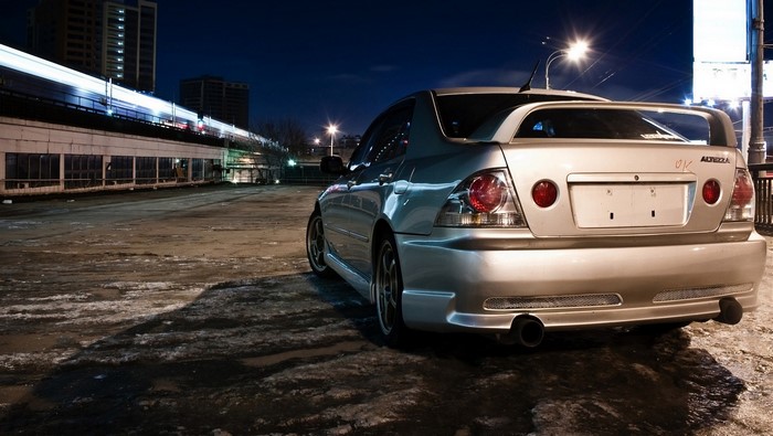 Silver Lexus IS Sedan with Spoiler at Night
