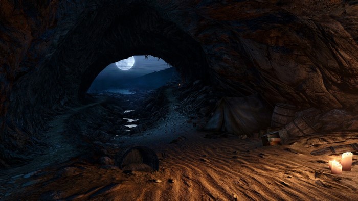 Cave entrance with a tent and barrels under the moon