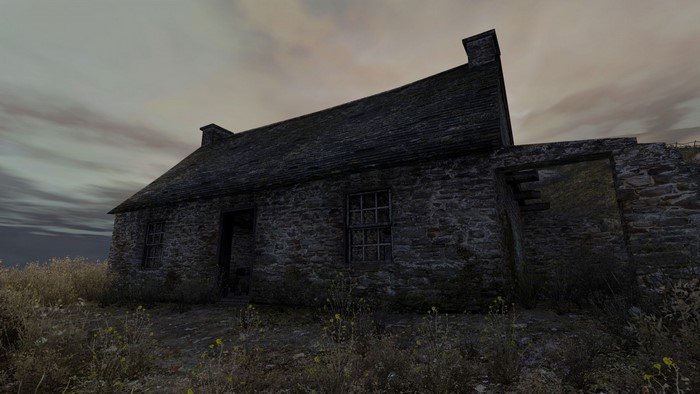 Ruined stone house in a rural area at dusk