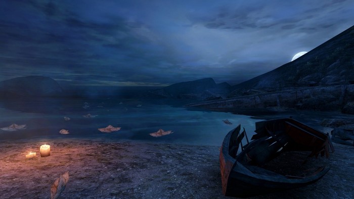Paper boats and candles on a lake at night