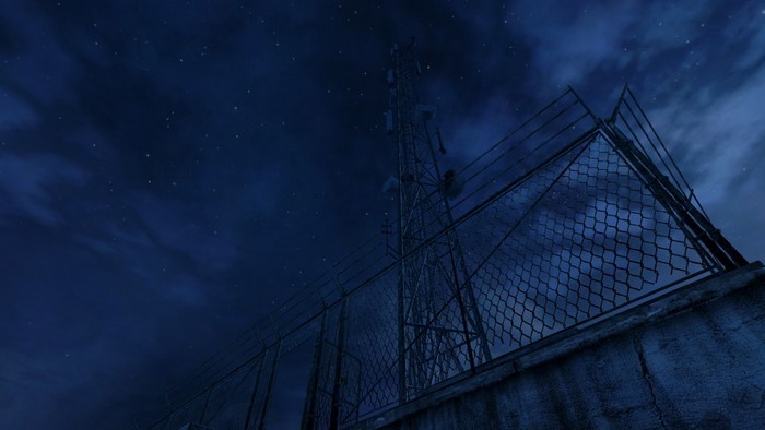 Cell tower at night with stars and clouds