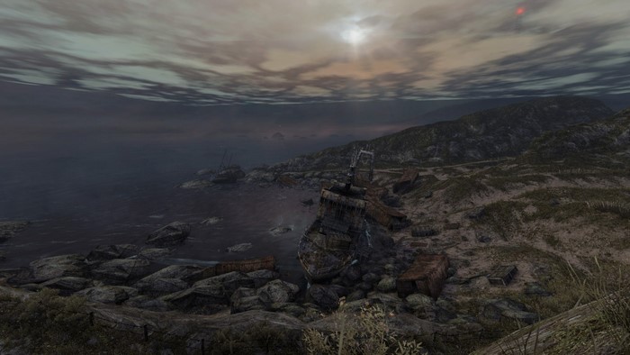 Wrecked ships on a rocky coast under a cloudy sky