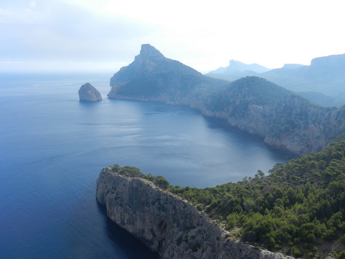 Coastal cliffs and sea with a rocky island