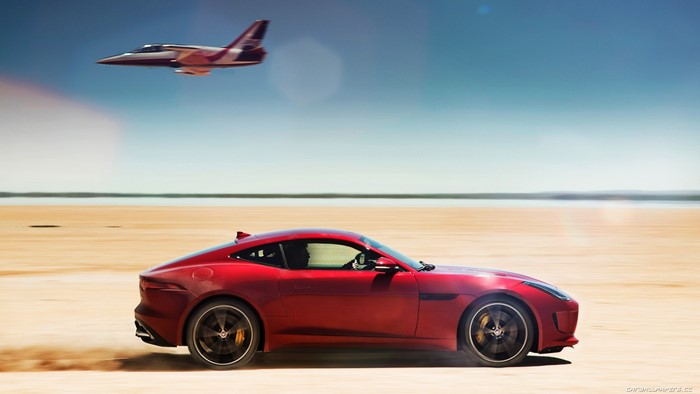 Red Jaguar F-Type and Jet Fighter in Desert