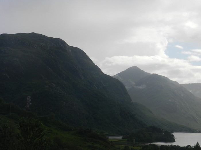 Misty mountains and a lake in a valley