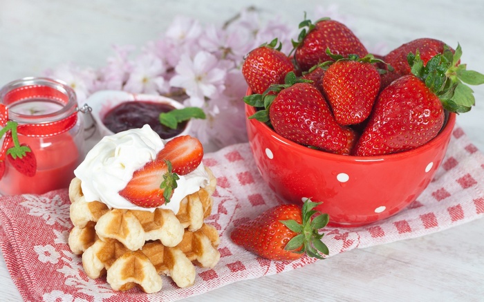 Waffles with whipped cream and strawberries