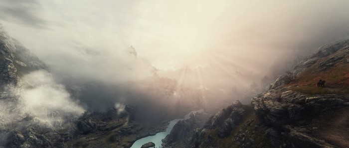 The Elder Scrolls V Skyrim landscape with mountains and mist