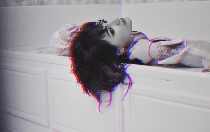 Woman lying in a bathtub with anaglyph 3D effect