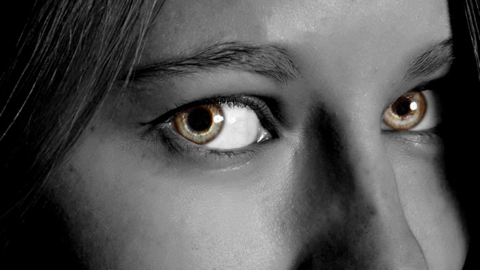 Close up of a person's eyes with selective coloring